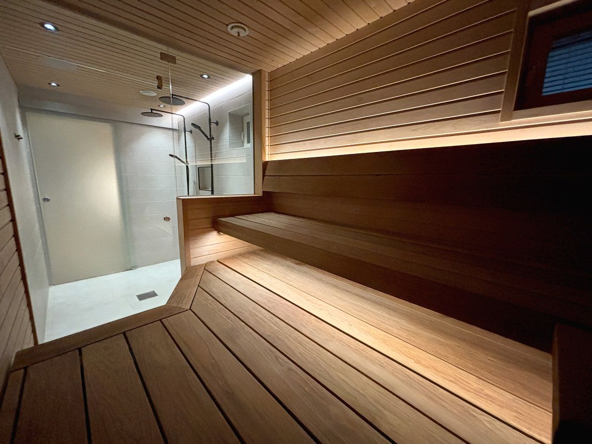 Low-intensity LED strip lighting along the entire length of the sauna seat brings space and lightness to the room © LedStore.fi